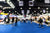 A blurry view of a busy tradeshow floor.
