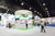 A blurred image of a circular trade show booth.
