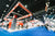 A blurred orange, rectangular tradeshow booth.