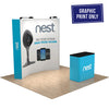 Front angled view of an 8ft curved pop-up display graphic with matching printed podium cover, shown on a light wood floor.