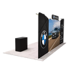 Rear angled view displaying the reverse side of the double-sided graphic panels, overhead header, and podium while showcasing the exhibit's dual-view presentation capabilities.