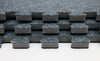 Detailed view of 20x10 Reversible Carpet Tile edges in dark grey, displaying durable foam connectors and reversible finish for professional booth setups.