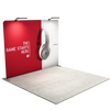 Angled booth view of trade show display showing frame depth, side profile, and overhead lighting placement.