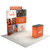 Three quarter booth view featuring a curved tension fabric backdrop, top header sign, and custom branded counter.