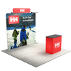 Three quarter booth view featuring a straight backdrop, LED lights, top header sign, and branded counter.