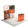 Angled booth view of the curved display with two top-mounted lights and matching podium.