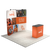 Angled booth view of the curved display with two top-mounted lights and matching podium.