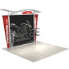Angled right view of the 10ft Timberline Heavy Duty display with curved canopy, center fabric backdrop, and wing panels on sample flooring.
