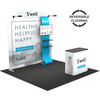 8ft QuickZip Max Straight trade show display with reversible flooring shown in alternating gray and black carpet tiles.