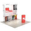 Angled left view of the 8ft 3D Snap-Up Display showing dimensional pop-up panels, open framework, and a branded podium positioned slightly forward.