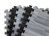 Close-up of 10x10 Reversible Wood Tiles in black and grey tones, highlighting interlocking foam edges and wood grain pattern used for portable booth flooring.