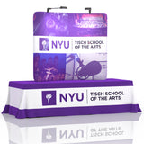 6ft QuickZip Table Top Display shown on a fitted table throw, featuring a compact curved fabric back wall with seamless panels and a sleek, portable frame setup.